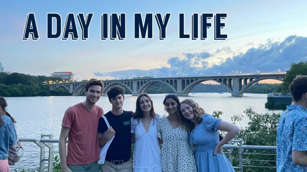 Five friends posing in front of Key Bridge with the text 